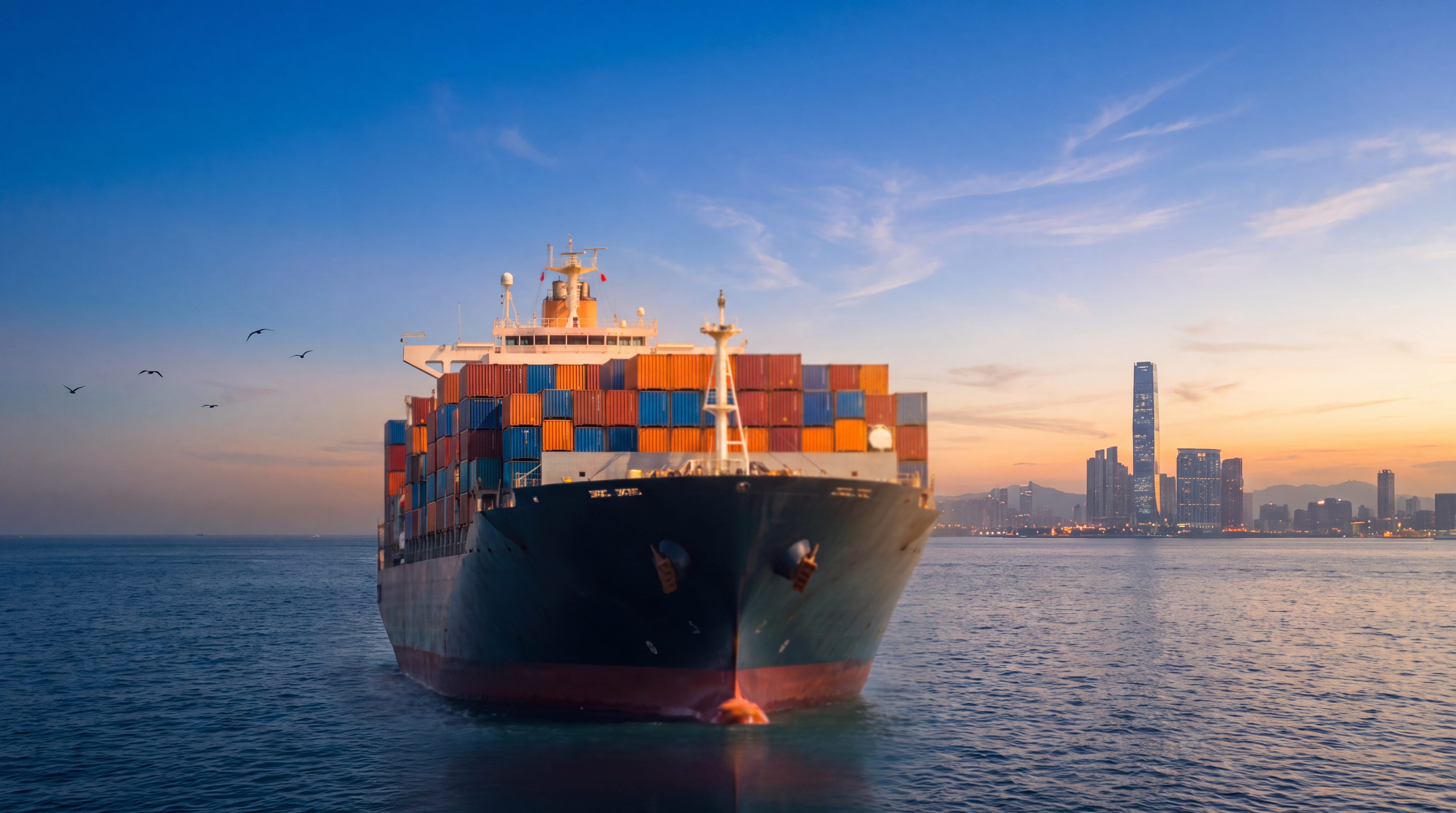 Container ship at sunset approaching Hong Kong harbour